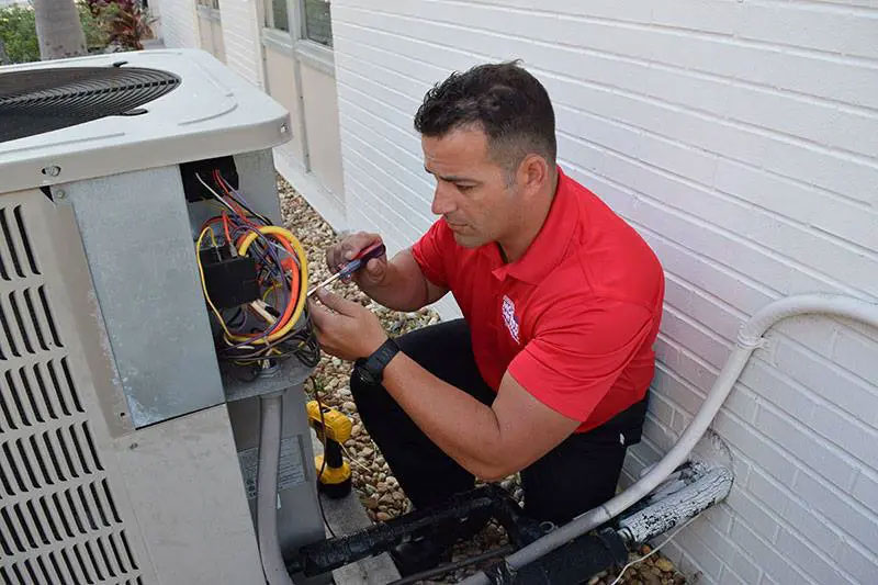 technician-working-on-ac-unit